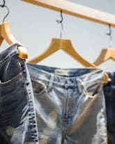 colorful background, fashion niche analysis, denim jeans display, apparel product research, trending clothing